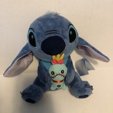 Peluche Stitch Holding Scrump